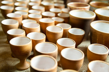 Background texture. Template. Products made of clay, folk crafts. Refractory products made of clay. hard, sticky fine-grained earth, usually yellow, and dried and baked to make and pottery