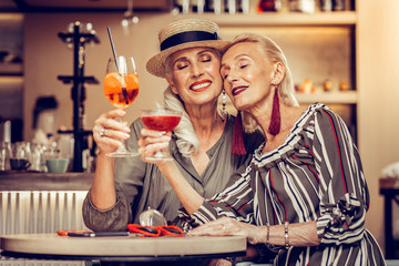 Attractive old ladies missing each other and celebrating reunion