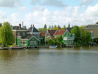 Fototapeta na wymiar Impressive Dutch Town on the Zaan Riverbank, Zaanstad, Netherlands 
