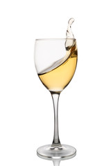White wine is poured into a wine glass on a white background.