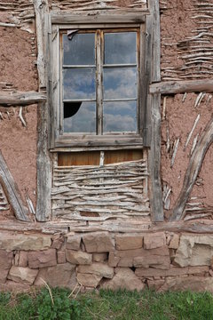 Old ruined house adobe and wood facade in village Gara Bov, Bulgaria. Old adobe wall. Brown, detail.