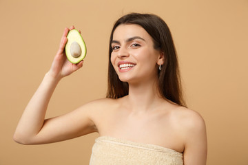 Close up brunette half naked woman 20s with perfect skin nude make up hold avocado isolated on...