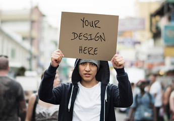 Person Holding Poster Mockup on the Street