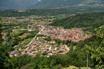 Fototapeta na wymiar Aerial view of small italian village Farra D'Alpago in alps near Santa Croce lake.