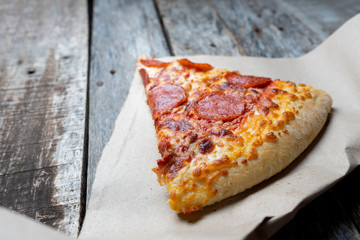 Hot slice of pepperoni pizza