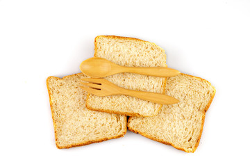 sliced bread and spoons isolated on white backgroun isolated on white backgroun
