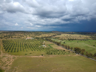 Fototapeta na wymiar Aerial view of a farm field with storm clouds in background. Alentejo Portugal