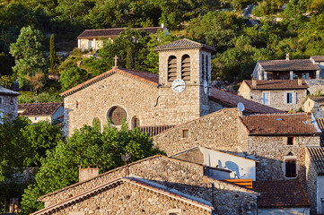 The clocktower and roofs of the medieval town of Vogue in France.