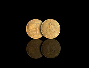 Golden Bitcoin Money Crypto Currency on Gold Background with Reflections