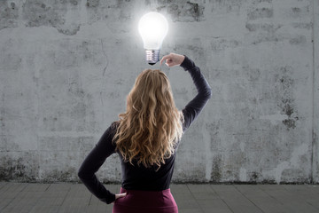 woman thinking with the light bulb on