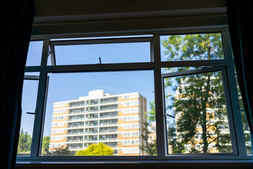 London, UK window from flat with view of Churchill Gardens neighborhood in Pimlico historic traditional style buildings in summer housing