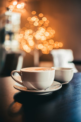 Cup of Coffee in a Cafe with Bokeh Background