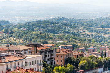 Fototapeta na wymiar Perugia in Umbria, Italy cityscape skyline view of rooftops of town village in summer landscape rolling hills