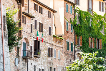 Perugia, Italy City in Umbria with old town village architecture and green plants gardens on sunny summer day