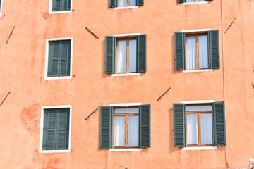 Fototapeta na wymiar Facade of Italian Windows at Venice City