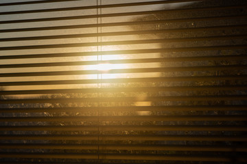 Sunrise seen through blinds