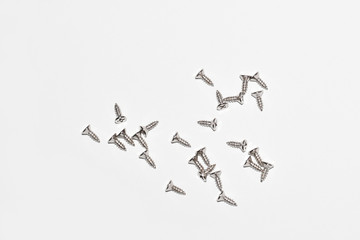 The screw, nut and bolts on white background. Closeup isolated on a white background