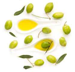 olive oil and fresh green olives isolated on white background.