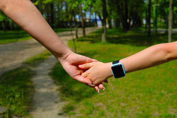 hands of baby and woman