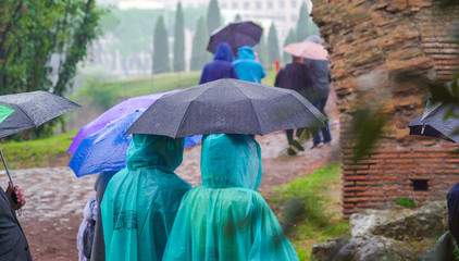 16118_The_tourists_wearing_raincoat_and_umbrella_in_Rome_in_Italy-100.jpg