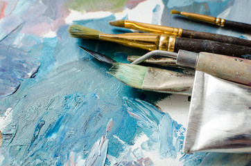 Artist paint brushes and oil paint tubes
