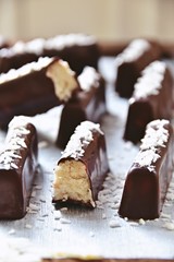 Homemade chocolate coconut bars. Sugar free, no bake. Keto, paleo, vegan bites