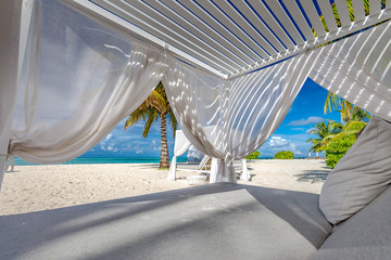 White beach canopies. Luxury beach tents at a resort. Wonderful view of beach scenery, luxury...