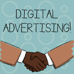 Writing note showing Digital Advertising. Business concept for marketing of products or services using internet Businessmen Shaking Hands Form of Greeting and Agreement