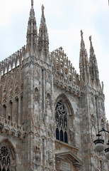 Fototapeta premium detail of the facade of the catholic cathedral in milan