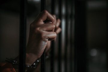 Hands of men desperate to catch the iron prison,prisoner concept,thailand people,Hope to be free.