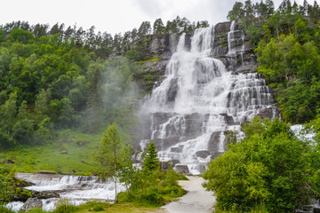Tvindefossen Waterfall is a gorgeous 152m waterfall near Voss tumbling in strands with a graceful character. Tourism, popular, Norway, Scandinavia