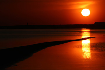 Fototapeta na wymiar solar track on the water sunset on the baltic sea coast, Parnu, Estonia