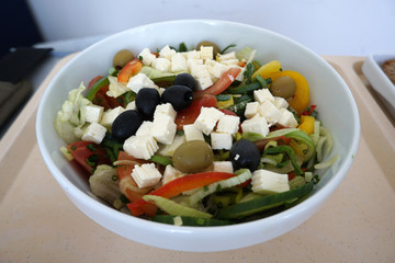 Peasant salad with fresh cheese Olives and tomatoes with tea and bread