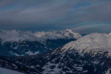 Fototapeta na wymiar Winter panorama of mountains in Pitztal Hoch Zeiger ski resort in Austria Alps. Ski slopes. Beautiful morning.