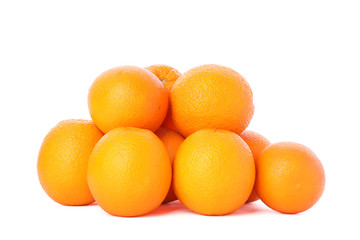 Pile of ripe oranges isolated on white background. Healthy food
