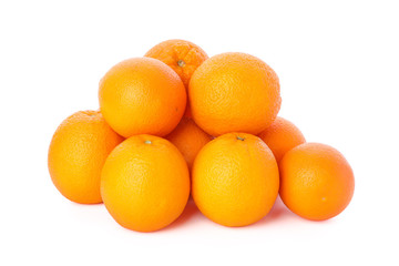 Pile of ripe oranges isolated on white background. Healthy food