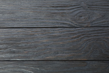 Naklejka premium Dark wooden background. Space for text, closeup