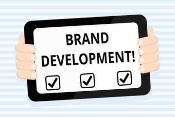 Writing note showing Brand Development. Business concept for improving customers knowledge and opinions of a brand Color Tablet Smartphone with Screen Handheld Back of Gadget