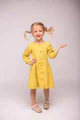 girl blonde green linen dress white background.girl the blonde smiles.the concept of summer and...