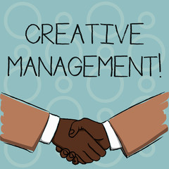 Writing note showing Creative Management. Business concept for Managing of creative thinking skills and mental process Businessmen Shaking Hands Form of Greeting and Agreement