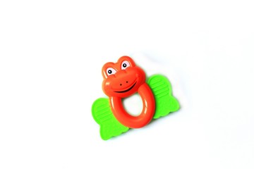 children's toy rattle in the form of a frog on a white background, isolate
