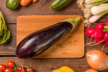 Aubergine and other fresh vegetables and ingredients for cooking