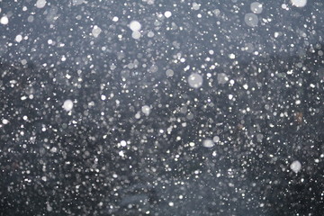 snow storm drops on window