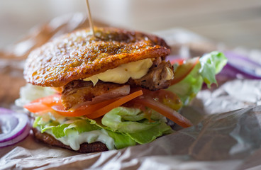 potato pancakes with meat, cheese, vegetables and sauce