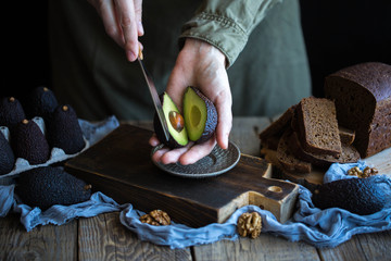  Avocado on black bread with nuts 