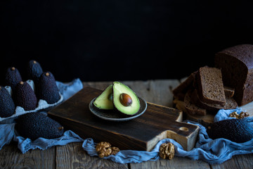  Avocado on black bread with nuts 