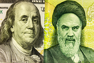 Portrait of Franklin on  banknote 100 US dollars and  Ayatollah Khomeini on Iranian rials. Concept of the exchange rate, stock exchange, internet trading.