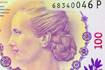 Enlarged fragment of  note is 100 Argentine pesos.