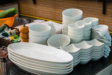 Stack of cleaned dishes in a restaurant room