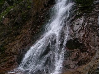 waterfall in the mountains, a mountain river with a waterfall